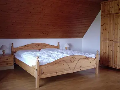 Ein Bett oder Betten in einem Zimmer der Unterkunft Ferienhaus Küste