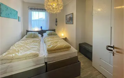 Ein Bett oder Betten in einem Zimmer der Unterkunft Nice Apartment In Friedrichskoog Spitze