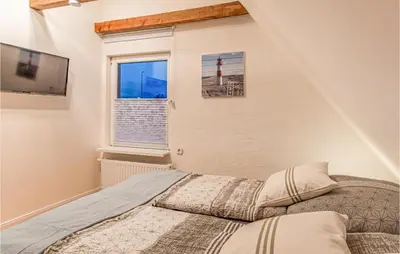 Ein Bett oder Betten in einem Zimmer der Unterkunft 3 Bedroom Cozy Home In Friedrichskoog