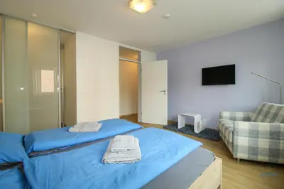 Ein Bett oder Betten in einem Zimmer der Unterkunft Residenz Hohe Lith Wohnung 04 01