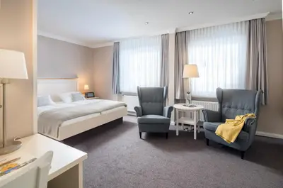 Ein Bett oder Betten in einem Zimmer der Unterkunft Akzent Hotel Dorn