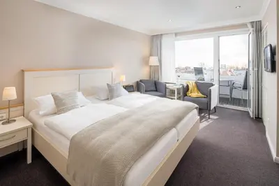 Ein Bett oder Betten in einem Zimmer der Unterkunft Akzent Hotel Dorn