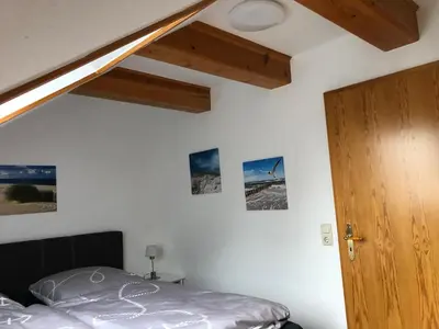 Ein Bett oder Betten in einem Zimmer der Unterkunft Heimathafen - Ferienwohnung Verse