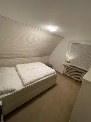 Ein Bett oder Betten in einem Zimmer der Unterkunft FeWo zum Surgrund