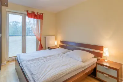 Ein Bett oder Betten in einem Zimmer der Unterkunft Strand Palais 18