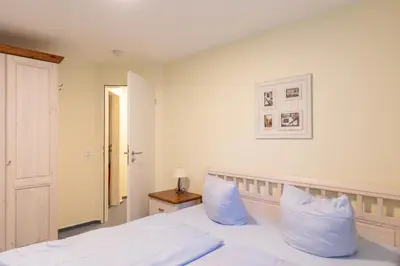 Ein Bett oder Betten in einem Zimmer der Unterkunft Knechtsand 417