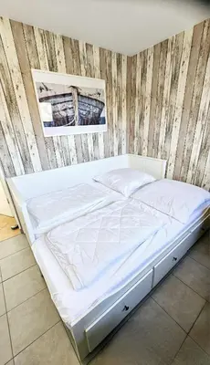 Ein Bett oder Betten in einem Zimmer der Unterkunft Lust auf Meer - Appartement Ferienwohnung Terrasse kleine Hunde willkommen Nähe Nordsee