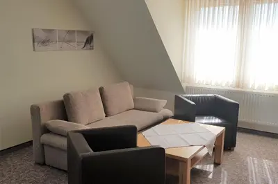 Ein Sitzbereich in der Unterkunft Landhaus Braband Ferienwohnungen - Cuxhavener Straße 96