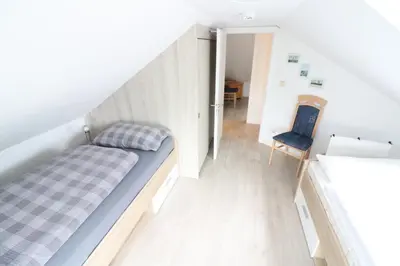 Ein Bett oder Betten in einem Zimmer der Unterkunft Appartmenthaus Nordlicht