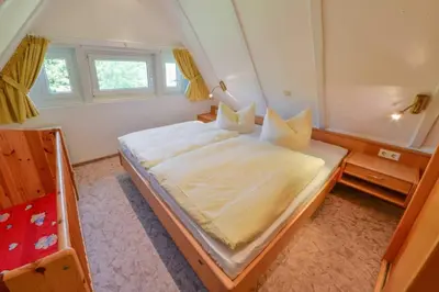 Ein Bett oder Betten in einem Zimmer der Unterkunft Landhaus Braband Ferienhaus ohne WLAN - Christian-Brütt-Weg