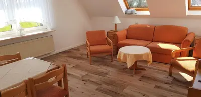 Ein Sitzbereich in der Unterkunft Landhaus Braband Ferienwohnungen - Gustav-Schönleber-Weg 2