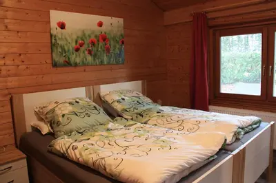 Ein Bett oder Betten in einem Zimmer der Unterkunft Ferienhaus Buchenblick