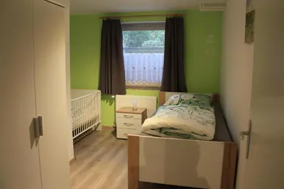 Ein Bett oder Betten in einem Zimmer der Unterkunft Ferienhaus Buchenblick