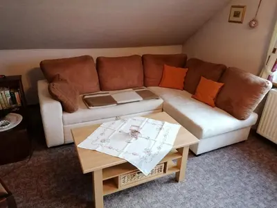 Ein Sitzbereich in der Unterkunft Ferienwohnung Wiesenweg