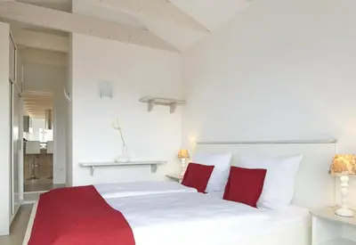 Ein Bett oder Betten in einem Zimmer der Unterkunft Sea Captain - Ferienwohnungen