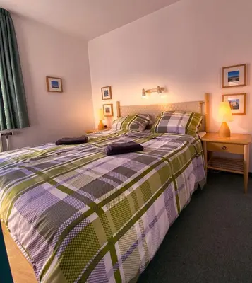 Ein Bett oder Betten in einem Zimmer der Unterkunft Ferienwohnung Gooß im Haus Pavillon