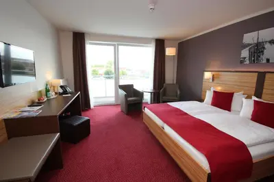 Ein Bett oder Betten in einem Zimmer der Unterkunft Hotel Hafen Büsum