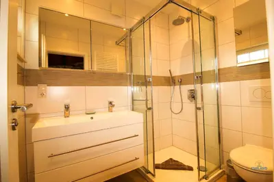 Ein Badezimmer in der Unterkunft Ferienhaus Christian Brütt Weg 23