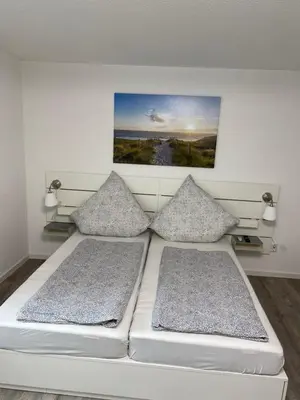 Ein Bett oder Betten in einem Zimmer der Unterkunft Pension Holter Deel