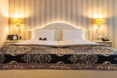Ein Bett oder Betten in einem Zimmer der Unterkunft Romantik Hotel Bösehof