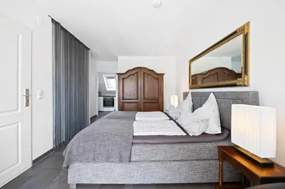 Ein Bett oder Betten in einem Zimmer der Unterkunft Sandkorn-Büsum