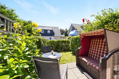 Ein Garten an der Unterkunft Sandkorn-Büsum