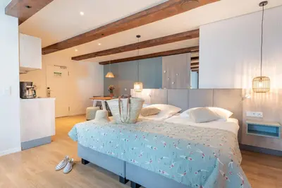 Ein Bett oder Betten in einem Zimmer der Unterkunft Hotel Strandhus