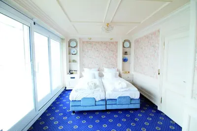 Ein Bett oder Betten in einem Zimmer der Unterkunft Hotel Strandperle