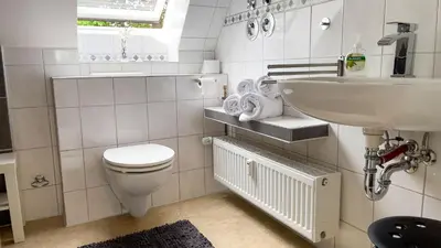 Ein Badezimmer in der Unterkunft Moderne Ferienwohnung für 4 Personen in Duhnen