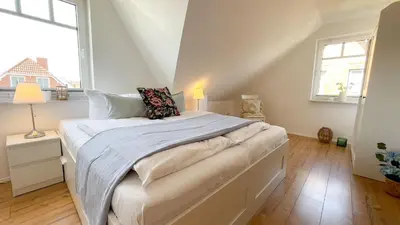 Ein Bett oder Betten in einem Zimmer der Unterkunft Haus Eversand 2