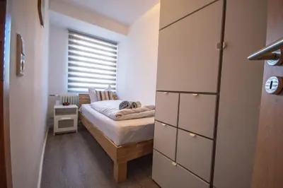 Ein Bett oder Betten in einem Zimmer der Unterkunft Neue Reihe 8 rechts