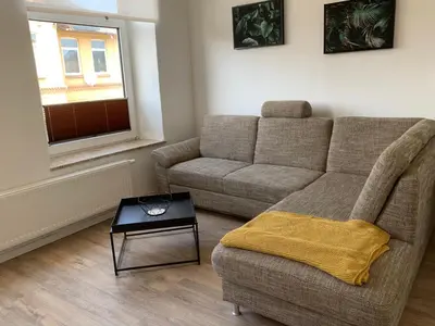 Ein Sitzbereich in der Unterkunft FEDDERSEN LIVING Moderne Ferienwohnungen - Gemütlich - Netflix - Voll ausgestattet - Waschmaschine - zentral gelegen