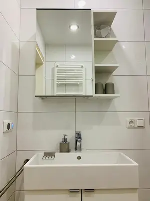 Ein Badezimmer in der Unterkunft Duhnentraum Balkon mit Meerblick & Top Lage, Parken, Wlan, Bettwäsche inklusive