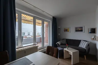 Ein Bett oder Betten in einem Zimmer der Unterkunft Knechtsand 455