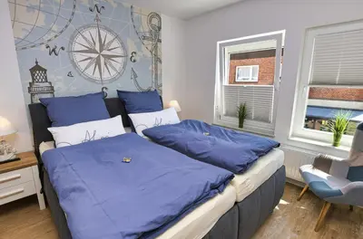 Ein Bett oder Betten in einem Zimmer der Unterkunft Ferienwohnung NORDIA Mitte