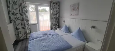Ein Bett oder Betten in einem Zimmer der Unterkunft Appartementhaus 