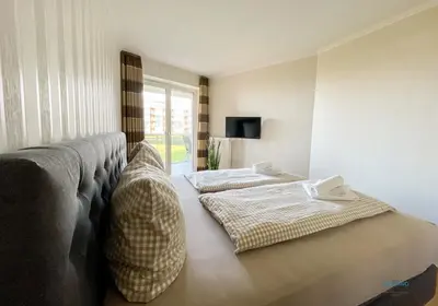 Ein Bett oder Betten in einem Zimmer der Unterkunft Strandpalais Duhnen Wohnung 3