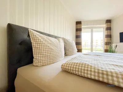 Ein Bett oder Betten in einem Zimmer der Unterkunft Strandpalais Duhnen Wohnung 3