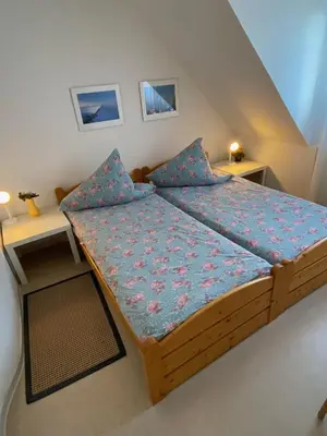 Ein Bett oder Betten in einem Zimmer der Unterkunft Haus Windjammer