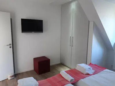 Ein Bett oder Betten in einem Zimmer der Unterkunft dat geele hus 2