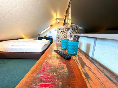 Ein Bett oder Betten in einem Zimmer der Unterkunft Hawaii - by Mila FerienARPartments - Büsum Zentrum eigener Parkplatz