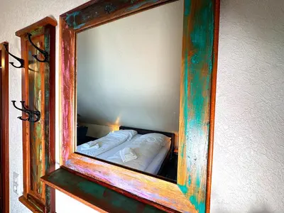 Ein Bett oder Betten in einem Zimmer der Unterkunft Hawaii - by Mila FerienARPartments - Büsum Zentrum eigener Parkplatz