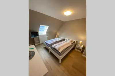 Ein Bett oder Betten in einem Zimmer der Unterkunft Ferienwohnung Zwischen Eider u. Elbe