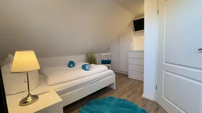 Ein Bett oder Betten in einem Zimmer der Unterkunft Wattn Traum 2