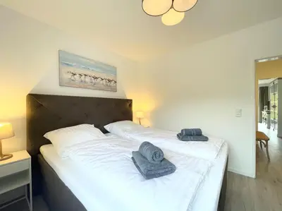 Ein Bett oder Betten in einem Zimmer der Unterkunft Seequartier 1