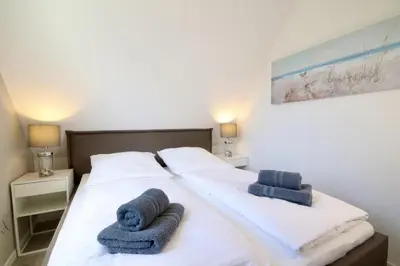 Ein Bett oder Betten in einem Zimmer der Unterkunft Seequartier 5