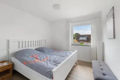 Ein Bett oder Betten in einem Zimmer der Unterkunft Wiebke