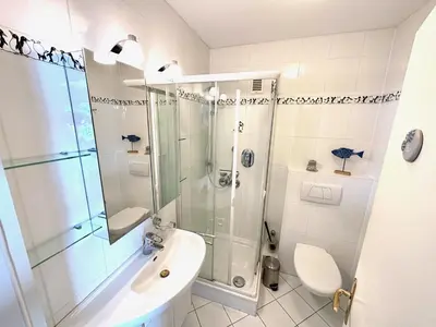 Ein Badezimmer in der Unterkunft Silbermöwe - Traumhafter Meerblick