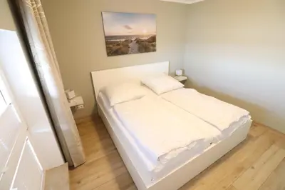 Ein Bett oder Betten in einem Zimmer der Unterkunft Haus Horizont 28