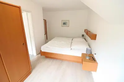 Ein Bett oder Betten in einem Zimmer der Unterkunft Haus Itjen Gelb 2